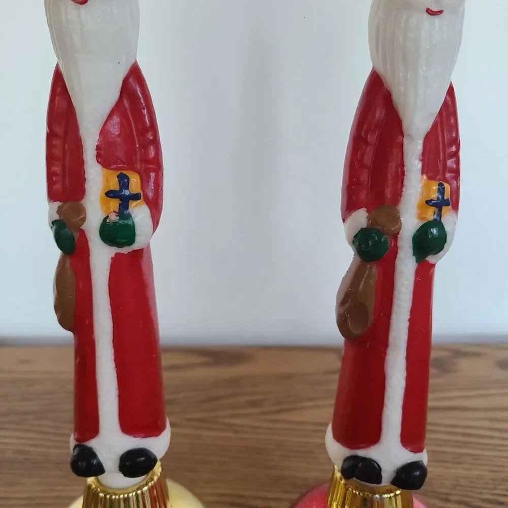 Two Vintage Santa Claus Character Candles In Christmas Ornament Candle Holders